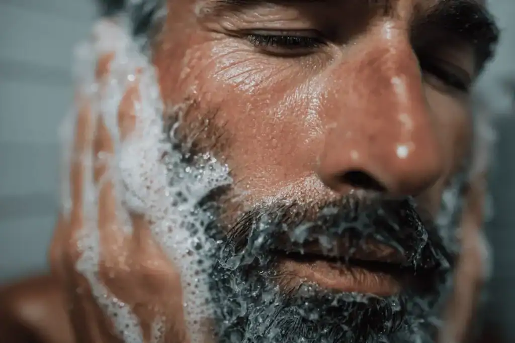 Washing a wiry beard properly to soften texture and reduce stiffness before conditioning