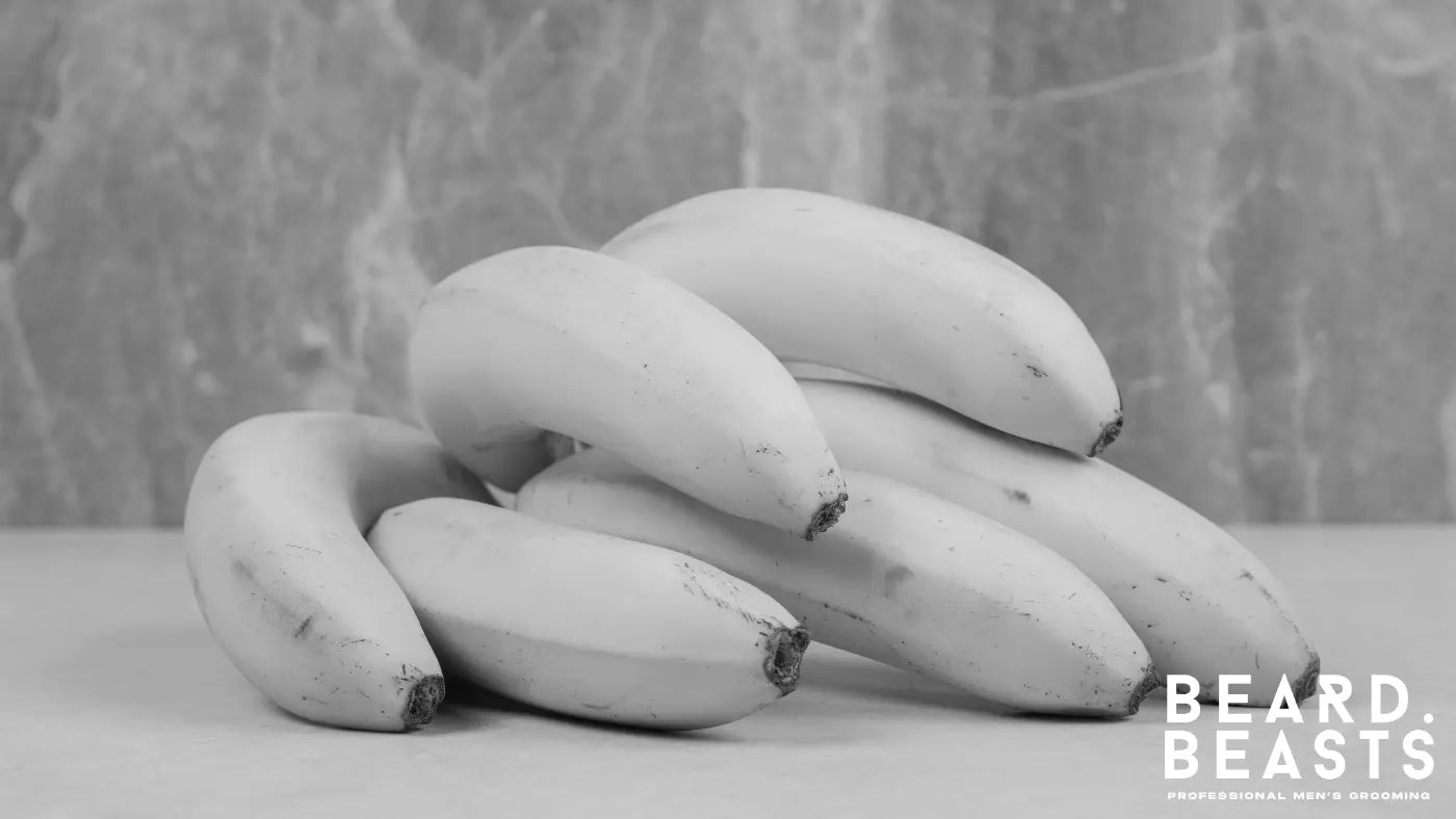 A bunch of fresh bananas, a fruit rich in biotin that supports keratin production for healthy beard growth.