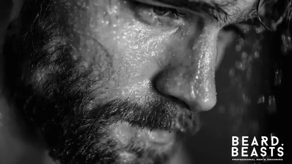 Man washing his beard to reduce beard itch and skin irritation