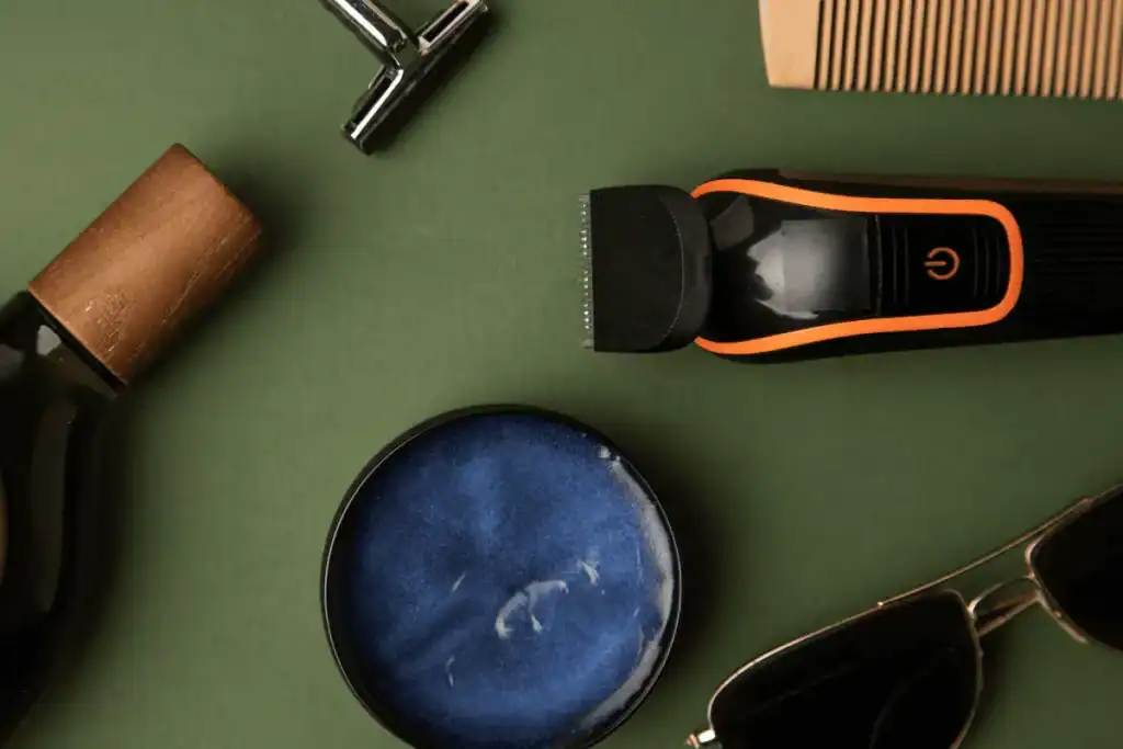 Minimal barbershop tools arranged on a clean surface, representing a streamlined, high-performance grooming routine.