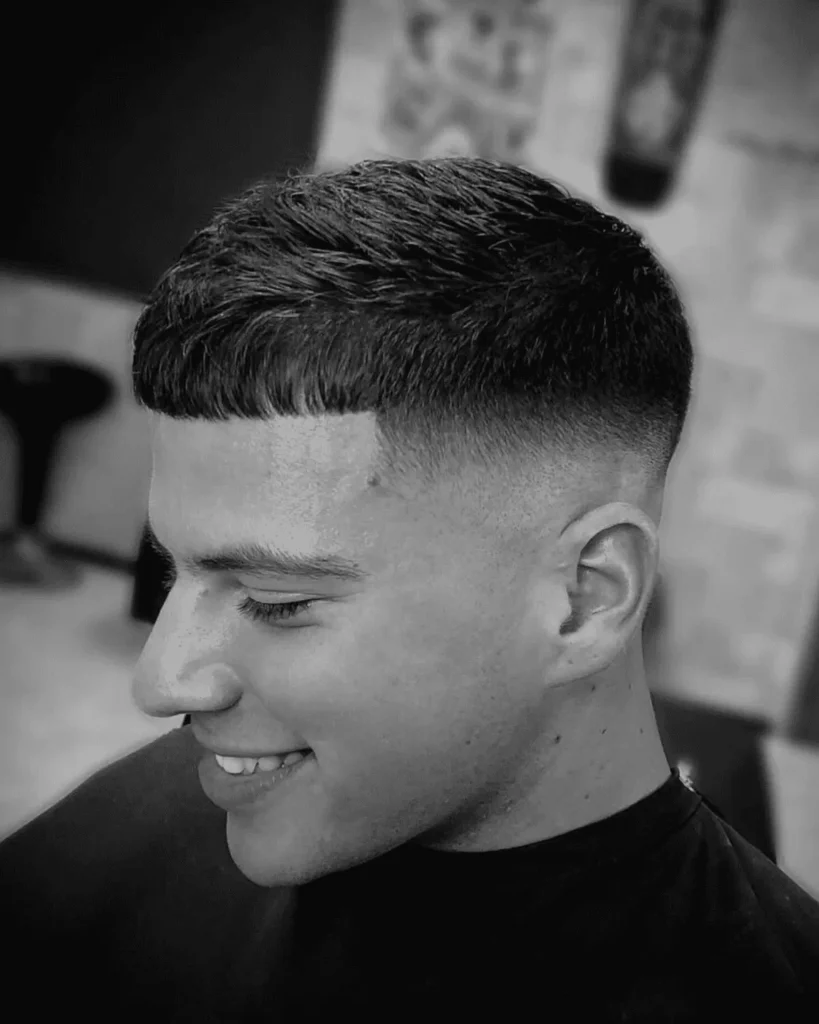 French crop haircut with blunt fringe and mid fade for men