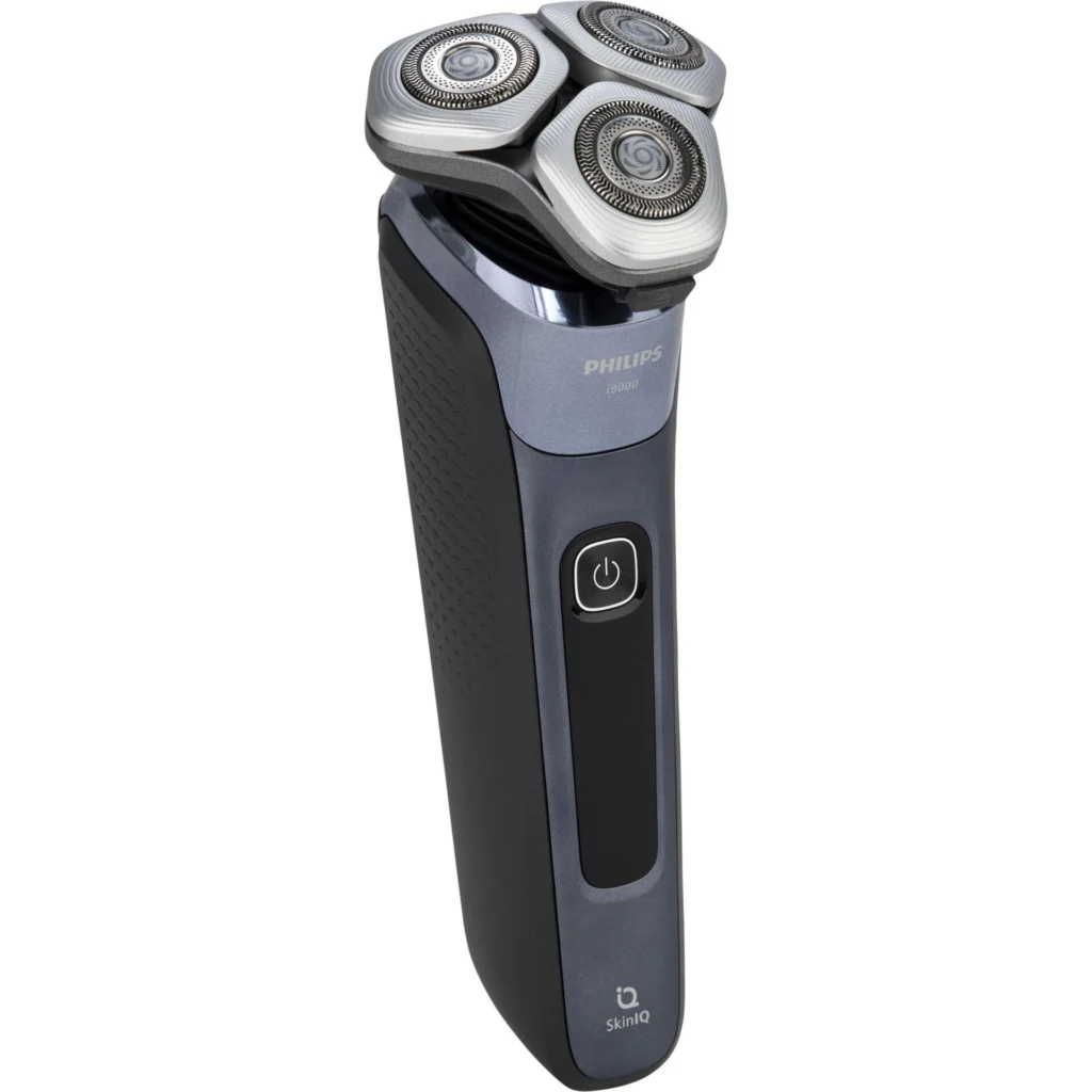 Philips Norelco i9000 electric shaver with three rotary heads on charging stand