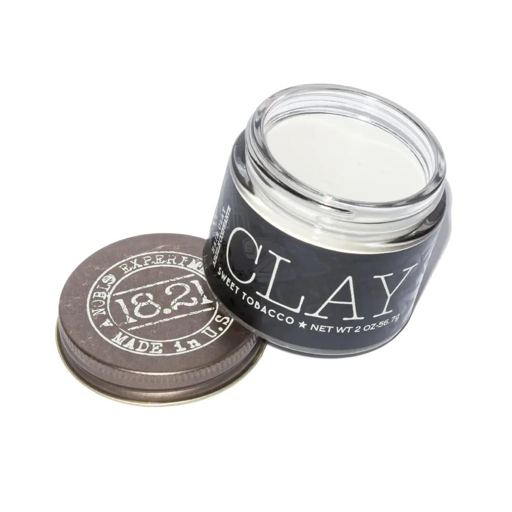 18.21 Man Made Clay matte hair styling product with open jar and lid
